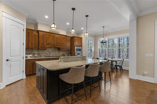 703 Timberbrook Trl, Salem, SC 29676 - kitchen featuring appliances with stainless steel finishes, wood finished floors, a chandelier, tasteful backsplash, and recessed lighting