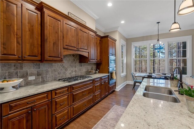 703 Timberbrook Trl, Salem, SC 29676 - kitchen with appliances with stainless steel finishes, a chandelier, dark wood-style flooring, tasteful backsplash, and pendant lighting