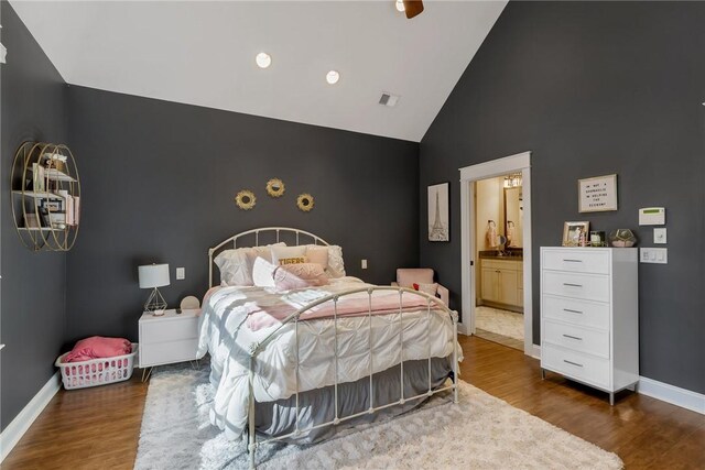 703 Timberbrook Trl, Salem, SC 29676 - bedroom with high vaulted ceiling, wood finished floors, ensuite bathroom, and an accent wall