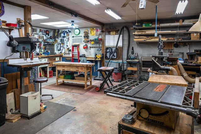 316 Brewer Rd, Walhalla, SC 29691 - miscellaneous room with a workshop area, ceiling fan, a drop ceiling, concrete flooring, and a wall unit AC