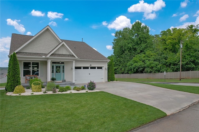 914 Blue Moon St, Taylors, SC 29687 - view of front of property with concrete driveway, a garage, a shingled roof, and covered porch