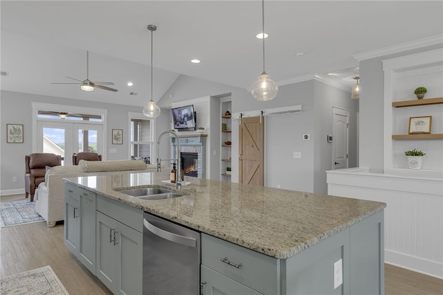 914 Blue Moon St, Taylors, SC 29687 - kitchen featuring stainless steel dishwasher, light wood-style floors, open shelves, ceiling fan, and built in shelves
