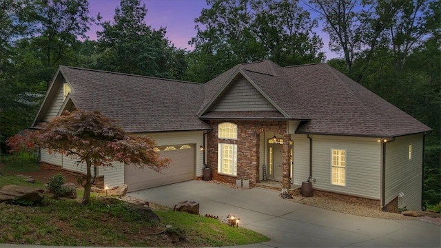 213 Redbud St, Seneca, SC 29672 - view of front facade featuring driveway, a garage, a shingled roof, and stone siding