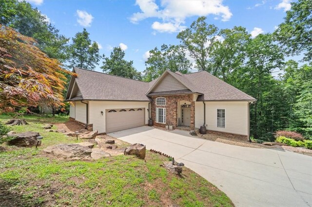 213 Redbud St, Seneca, SC 29672 - view of front of property featuring an attached garage, driveway, and a shingled roof