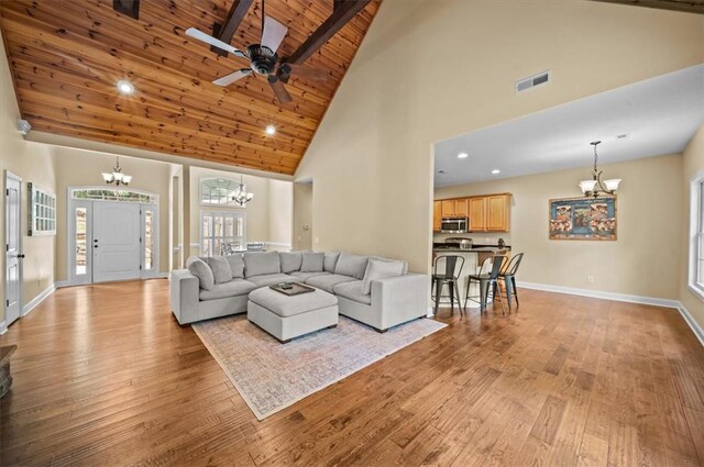 213 Redbud St, Seneca, SC 29672 - living room with a chandelier, high vaulted ceiling, a wood ceiling with exposed beams, light wood-type flooring, and ceiling fan