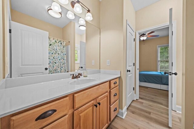 213 Redbud St, Seneca, SC 29672 - bathroom featuring vanity, wood finished floors, a ceiling fan, and ensuite bath