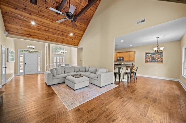 213 Redbud St, Seneca, SC 29672 - living room with a chandelier, high vaulted ceiling, a wooden ceiling with exposed beams, light wood-type flooring, and ceiling fan