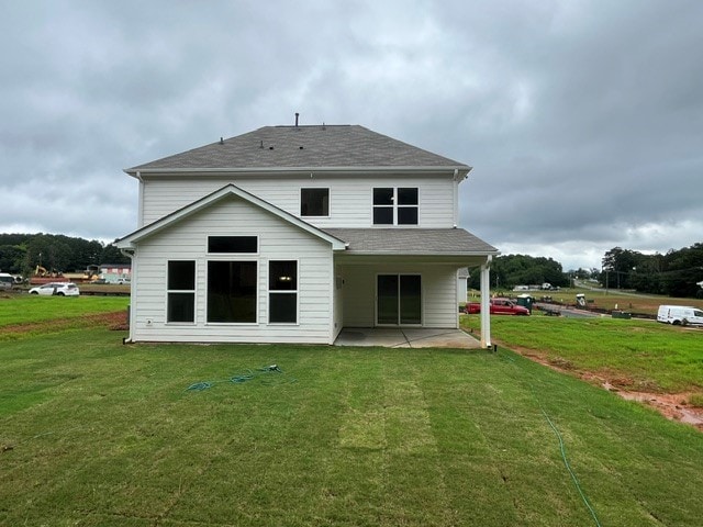 109 Sunrise Ct Unit Sun0005, Anderson, SC 29625 - rear view of house featuring a patio area, a lawn, and a shingled roof