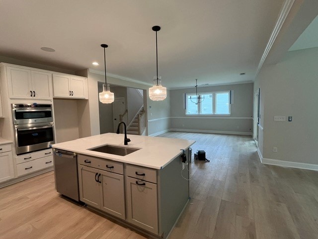 109 Sunrise Ct Unit Sun0005, Anderson, SC 29625 - kitchen featuring appliances with stainless steel finishes, ornamental molding, white cabinets, light countertops, and light wood-style flooring