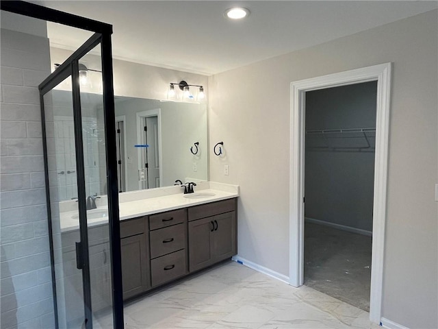 109 Sunrise Ct Unit Sun0005, Anderson, SC 29625 - bathroom with double vanity, a walk in closet, a shower stall, marble finish floors, and recessed lighting