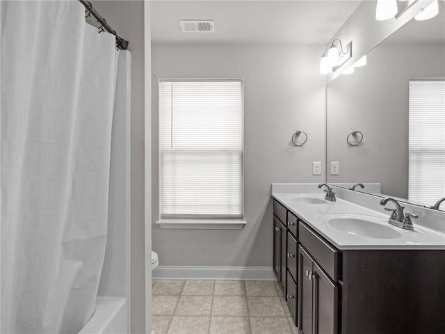 112 Wilbur St, Easley, SC 29640 - bathroom with double vanity, healthy amount of natural light, and shower / bath combo with shower curtain