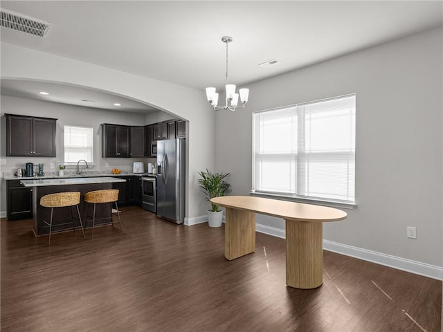 112 Wilbur St, Easley, SC 29640 - kitchen featuring stainless steel appliances, a kitchen bar, a chandelier, light countertops, and a kitchen island