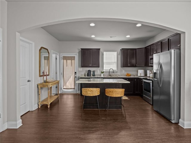 112 Wilbur St, Easley, SC 29640 - kitchen featuring appliances with stainless steel finishes, dark brown cabinetry, dark wood-style floors, and recessed lighting