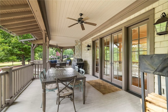 129 N Lawn Dr, Sunset, SC 29685 - porch with french doors, ceiling fan, and outdoor dining space
