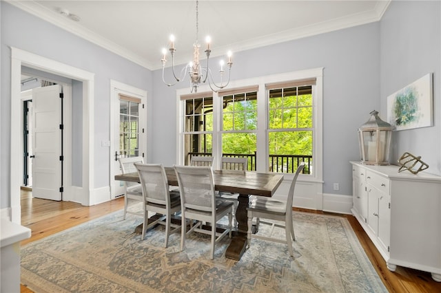 129 N Lawn Dr, Sunset, SC 29685 - dining space with wood finished floors, a chandelier, and ornamental molding