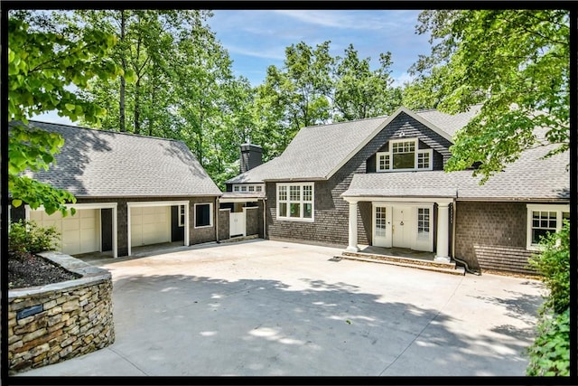 6 Skipper Ln, Salem, SC 29676 - shingle-style home with driveway, a chimney, a shingled roof, and a garage