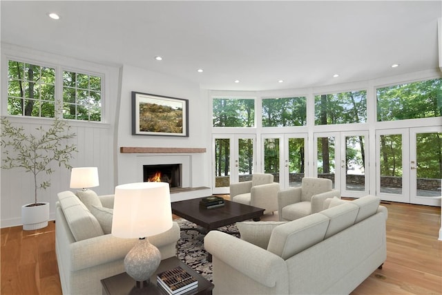6 Skipper Ln, Salem, SC 29676 - living room featuring french doors, a lit fireplace, recessed lighting, and wood finished floors