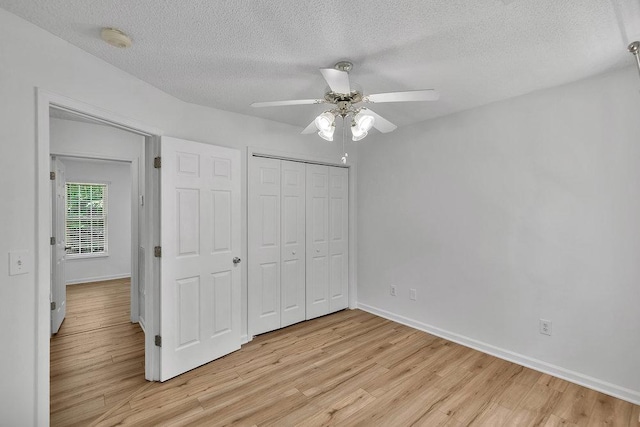433 Den Ridge Dr, Walhalla, SC 29691 - unfurnished bedroom featuring light wood-style floors, a textured ceiling, a closet, and ceiling fan