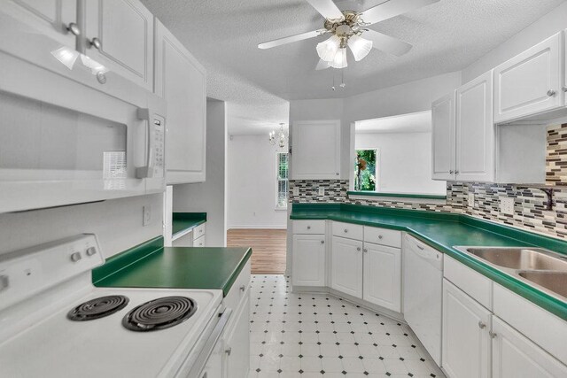 433 Den Ridge Dr, Walhalla, SC 29691 - kitchen with white appliances, light floors, white cabinets, ceiling fan, and a textured ceiling