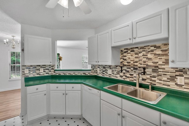 433 Den Ridge Dr, Walhalla, SC 29691 - kitchen with white dishwasher, a ceiling fan, white cabinets, tasteful backsplash, and light floors