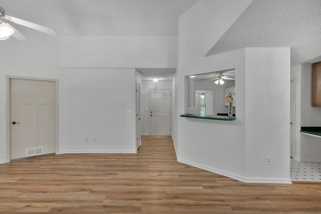 433 Den Ridge Dr, Walhalla, SC 29691 - spare room with ceiling fan, light wood-style floors, and a towering ceiling