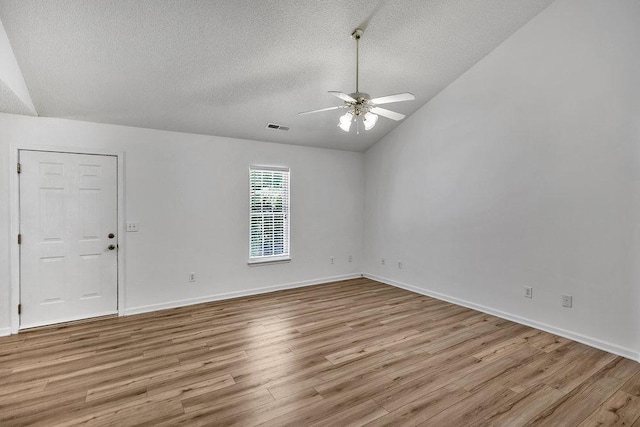 433 Den Ridge Dr, Walhalla, SC 29691 - spare room featuring a textured ceiling, wood finished floors, ceiling fan, and lofted ceiling
