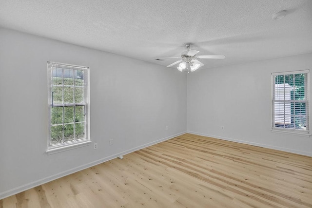 433 Den Ridge Dr, Walhalla, SC 29691 - spare room featuring light wood finished floors, healthy amount of natural light, a textured ceiling, and a ceiling fan