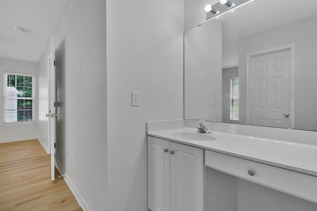433 Den Ridge Dr, Walhalla, SC 29691 - bathroom with wood finished floors, vanity, and a textured ceiling