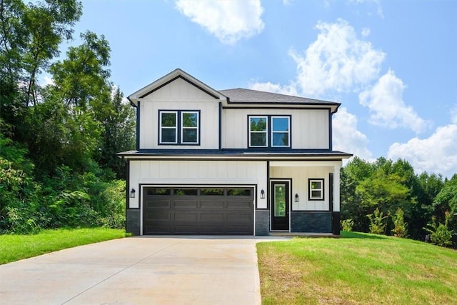 123 Moore Dr, Easley, SC 29642 - view of front facade featuring a garage, concrete driveway, and a front yard
