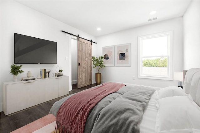 123 Moore Dr, Easley, SC 29642 - bedroom featuring a barn door, dark wood-type flooring, and recessed lighting
