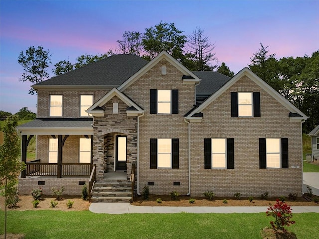 740 Enoree River Pl, Greer, SC 29651 - view of front facade with covered porch, a lawn, brick siding, and crawl space