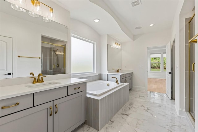 740 Enoree River Pl, Greer, SC 29651 - full bath featuring a shower stall, two vanities, marble finish floors, a garden tub, and recessed lighting
