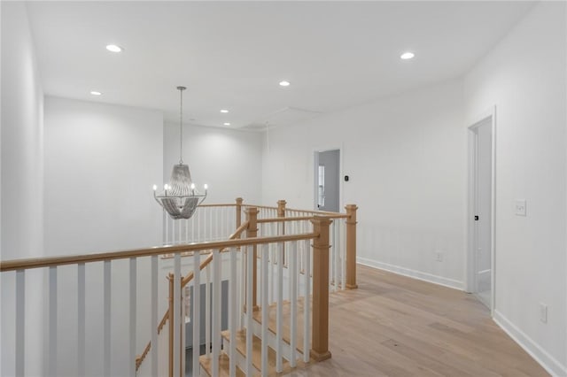 740 Enoree River Pl, Greer, SC 29651 - corridor with an upstairs landing, light wood-style floors, recessed lighting, and a chandelier