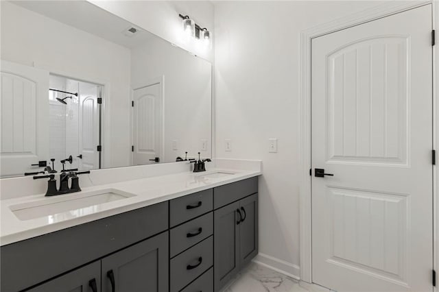 740 Enoree River Pl, Greer, SC 29651 - bathroom featuring double vanity, marble finish flooring, and a shower