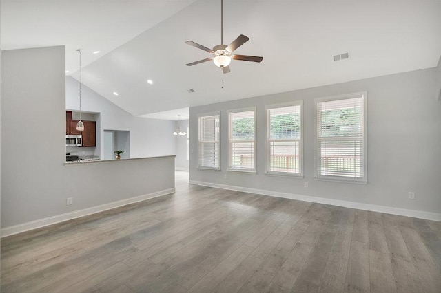 618 Motor Boat Way, Seneca, SC 29672 - unfurnished living room with ceiling fan, wood finished floors, high vaulted ceiling, a chandelier, and recessed lighting