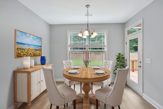 618 Motor Boat Way, Seneca, SC 29672 - dining room with a chandelier, light wood-style floors, and plenty of natural light