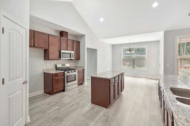 618 Motor Boat Way, Seneca, SC 29672 - kitchen with stainless steel appliances, light wood-type flooring, a center island, light stone countertops, and recessed lighting