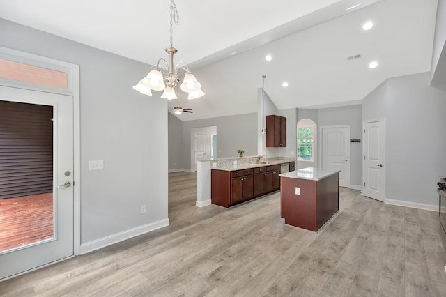 618 Motor Boat Way, Seneca, SC 29672 - kitchen featuring a chandelier, light wood-type flooring, hanging light fixtures, a kitchen island, and light stone countertops