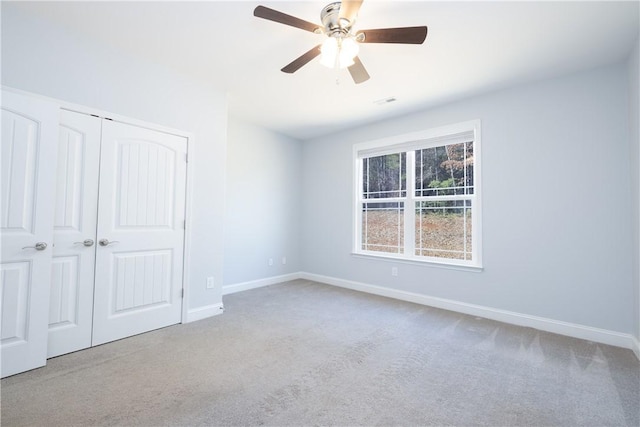 618 Motor Boat Way, Seneca, SC 29672 - unfurnished bedroom with carpet, a closet, and a ceiling fan