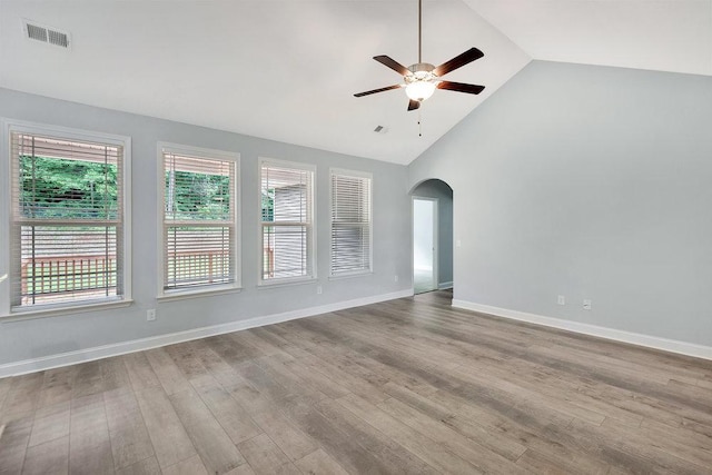 618 Motor Boat Way, Seneca, SC 29672 - empty room featuring a ceiling fan, arched walkways, wood finished floors, and high vaulted ceiling