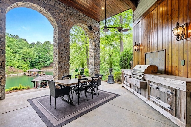 264 Featherstone Dr, Sunset, SC 29685 - view of patio / terrace with outdoor dining area, an outdoor kitchen, and a water view