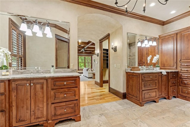 264 Featherstone Dr, Sunset, SC 29685 - bathroom featuring ornamental molding, two vanities, a walk in closet, and recessed lighting