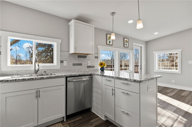 562 Lowndes Hill Rd, Greenville, SC 29607 - kitchen featuring dishwasher, a peninsula, healthy amount of natural light, dark wood-style flooring, and recessed lighting