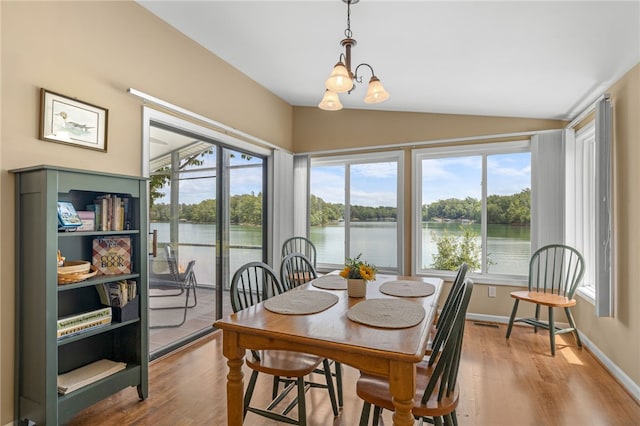 1230 Melton Rd Unit 24, West Union, SC 29696 - dining space featuring vaulted ceiling, wood finished floors, and a water view