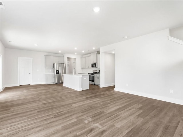 791 Burghley Cir, Greer, SC 29651 - unfurnished living room featuring recessed lighting and light wood finished floors