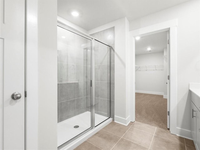 791 Burghley Cir, Greer, SC 29651 - bathroom featuring vanity, a shower stall, tile patterned floors, a walk in closet, and recessed lighting