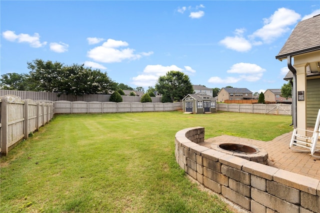 100 Dartford Ct, Easley, SC 29642 - fenced backyard with a storage unit, a fire pit, a patio, and a residential view