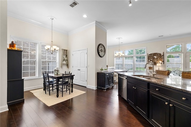 100 Dartford Ct, Easley, SC 29642 - kitchen with a chandelier, dark cabinetry, stainless steel dishwasher, stone counters, and ornamental molding