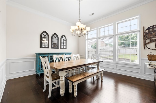 100 Dartford Ct, Easley, SC 29642 - dining room featuring a chandelier, dark wood finished floors, wainscoting, ornamental molding, and a decorative wall