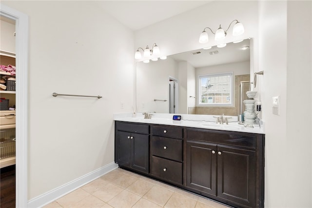 100 Dartford Ct, Easley, SC 29642 - full bathroom with double vanity, tile patterned flooring, a shower, and a walk in closet